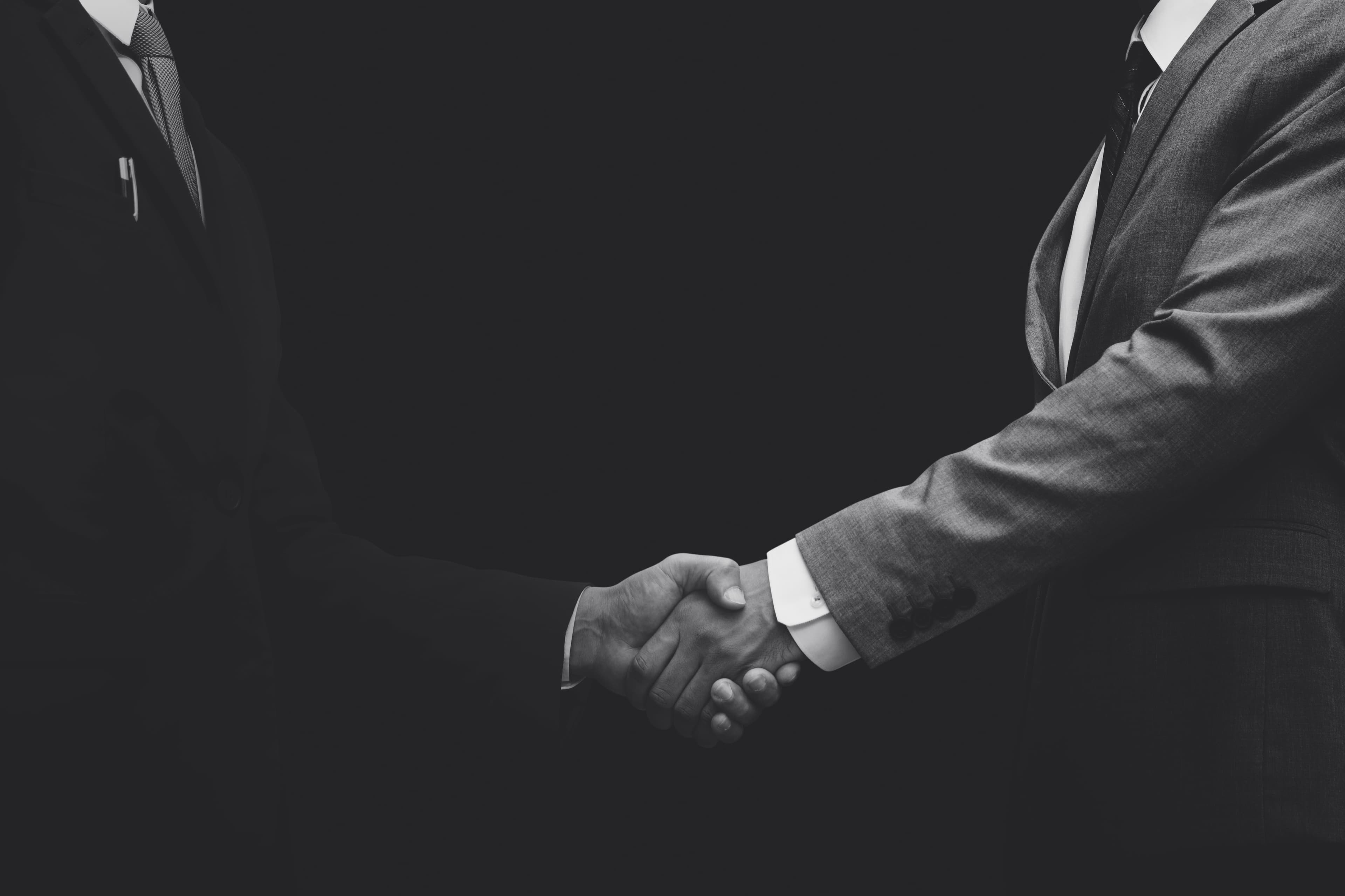 Corporate partnership handshake